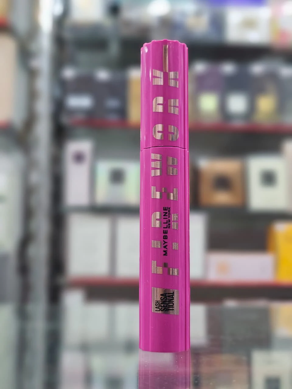 Maybelline New York Lash Sensational Firework Washable Mascara in its bright pink tube